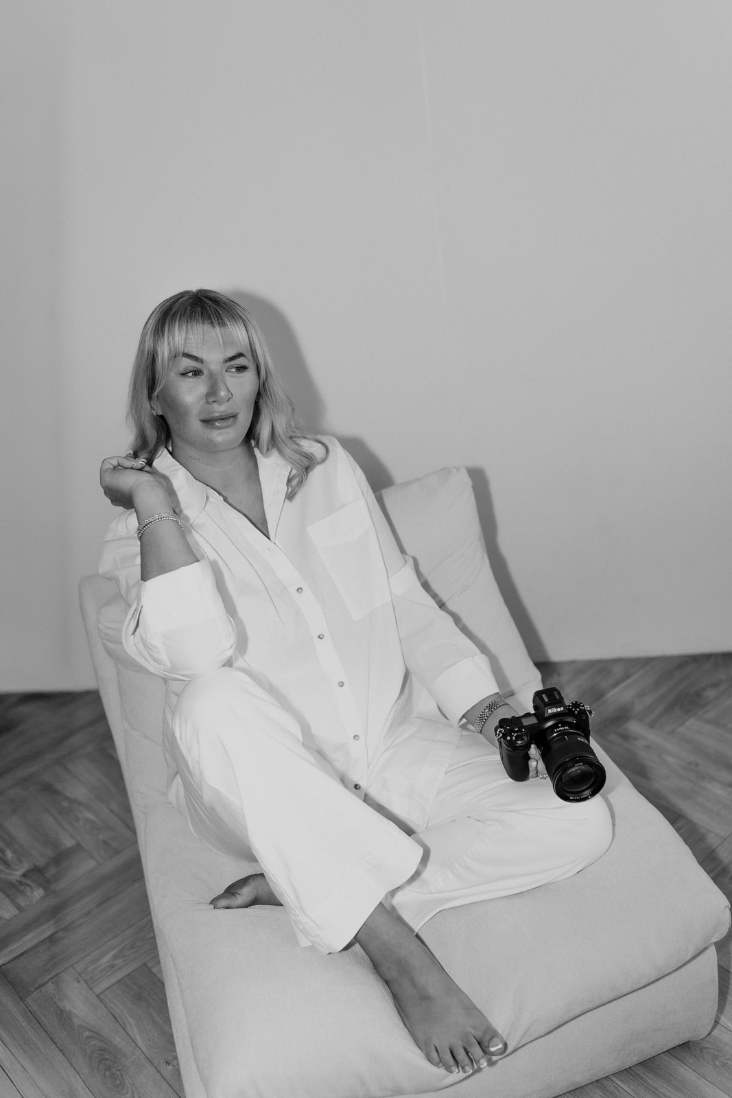 Black and white portrait of Robyn with her camera