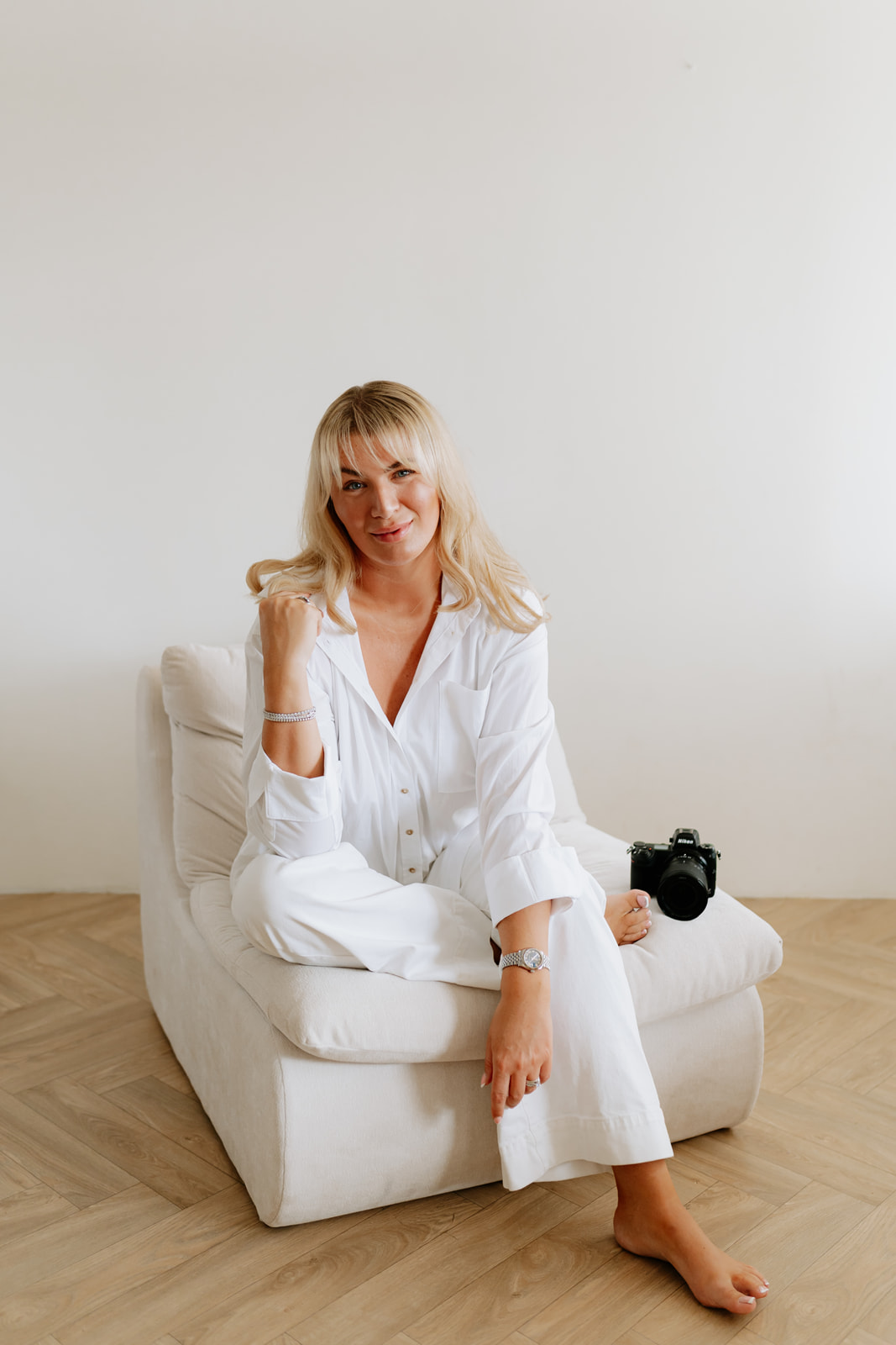 Robyn seated with her camera