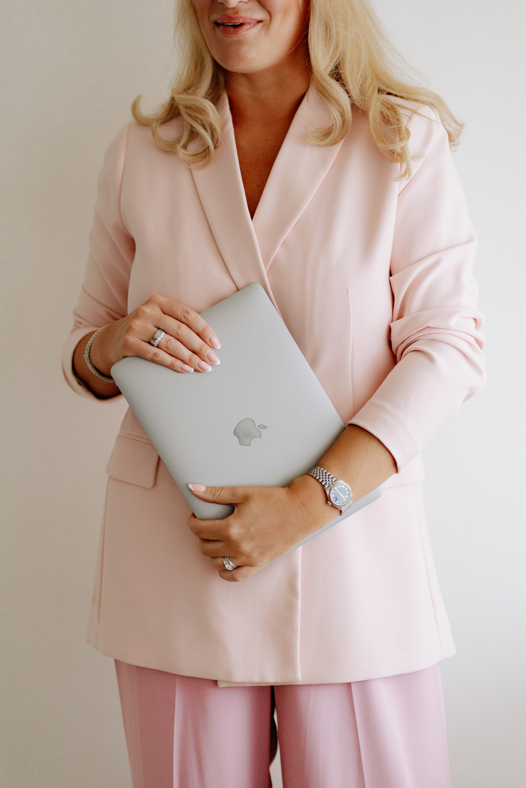 Robyn in a pale pink suit
