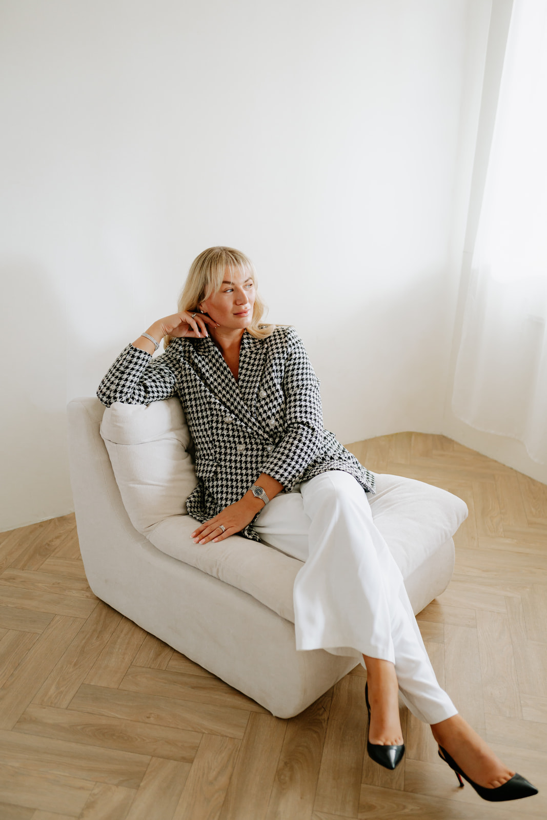 Robyn seated in her photography studio